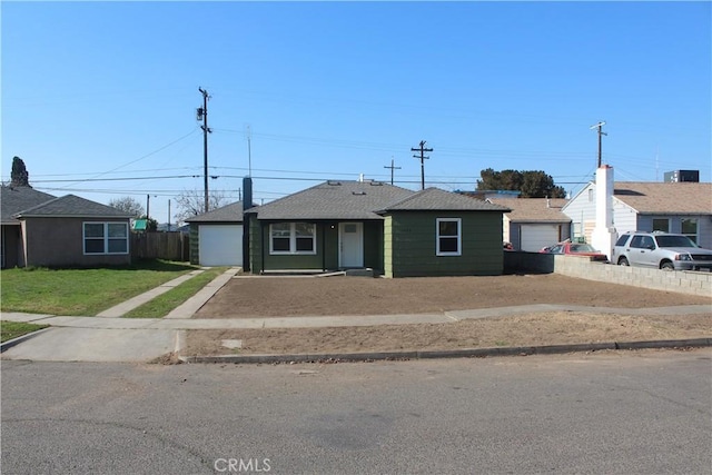 ranch-style home with a front yard