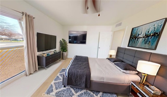 bedroom with hardwood / wood-style floors