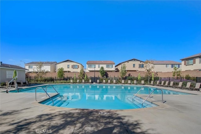 view of swimming pool featuring a patio area