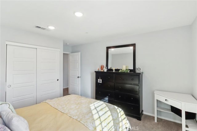 bedroom with a closet and carpet flooring