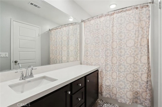 bathroom with vanity and a shower with shower curtain