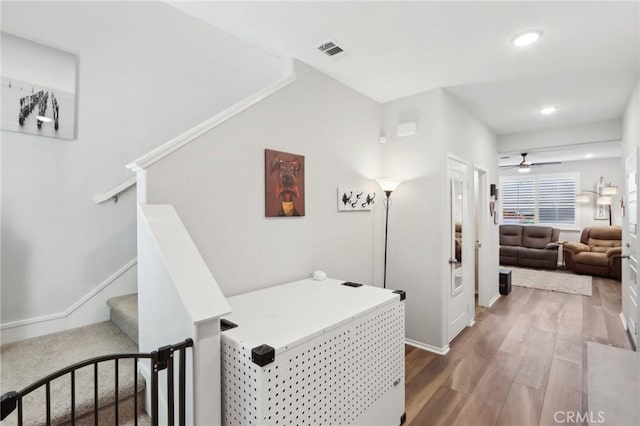 hallway with wood-type flooring