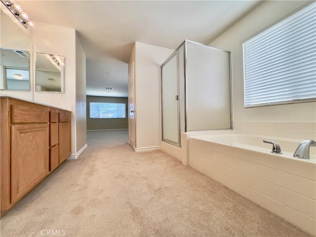 bathroom with independent shower and bath and vanity