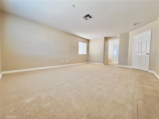 empty room featuring light colored carpet