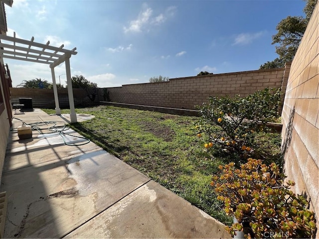 view of yard with a pergola and a patio area