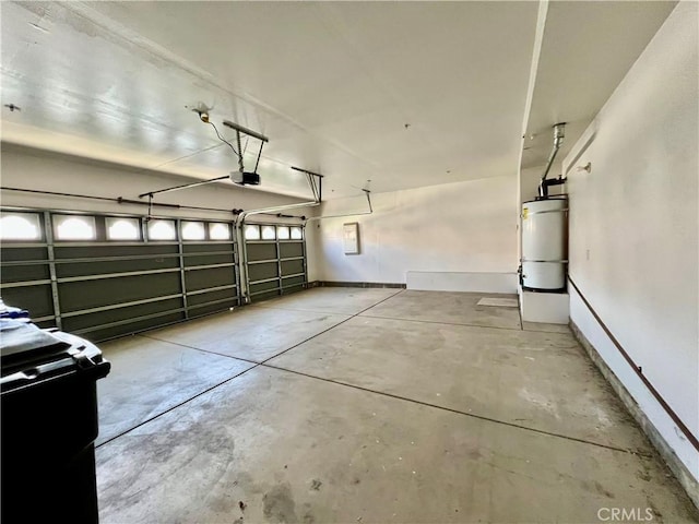 garage featuring a garage door opener and strapped water heater