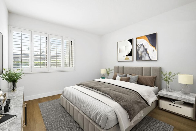 bedroom with dark wood-type flooring