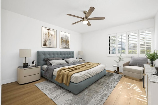 bedroom featuring ceiling fan and light hardwood / wood-style flooring