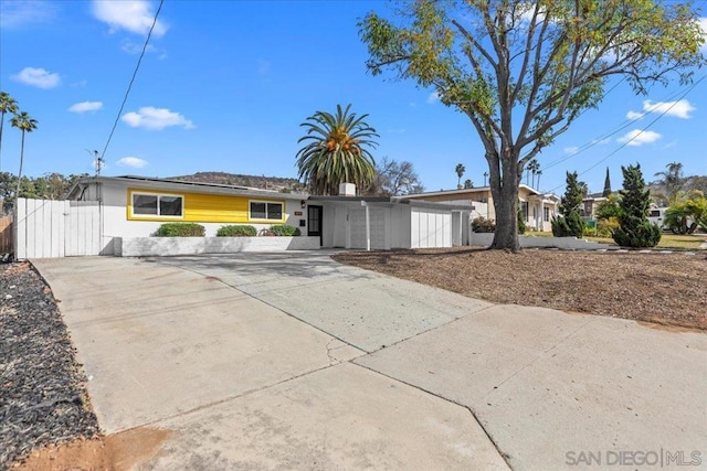 ranch-style house featuring a garage