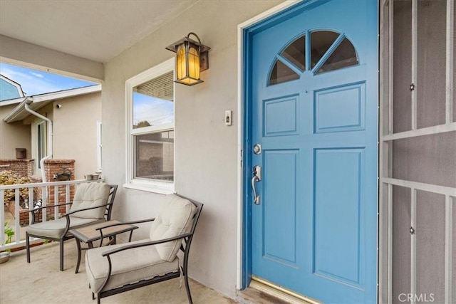 entrance to property featuring a porch