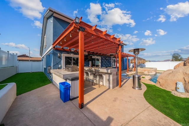 view of patio / terrace featuring exterior bar, area for grilling, and a pergola