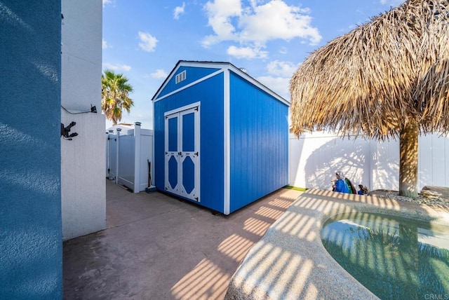 view of outbuilding featuring a fenced in pool