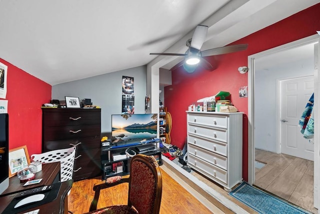 office space with ceiling fan, vaulted ceiling, and light wood-type flooring