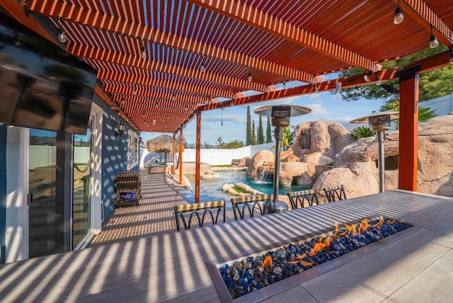 view of patio featuring a fenced in pool, a pergola, and pool water feature