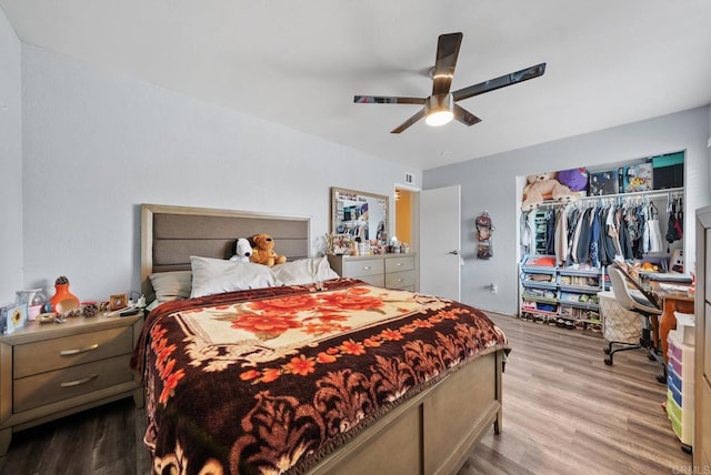 bedroom featuring light hardwood / wood-style flooring, a closet, and ceiling fan