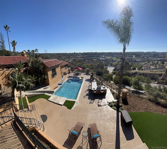 view of pool featuring a patio