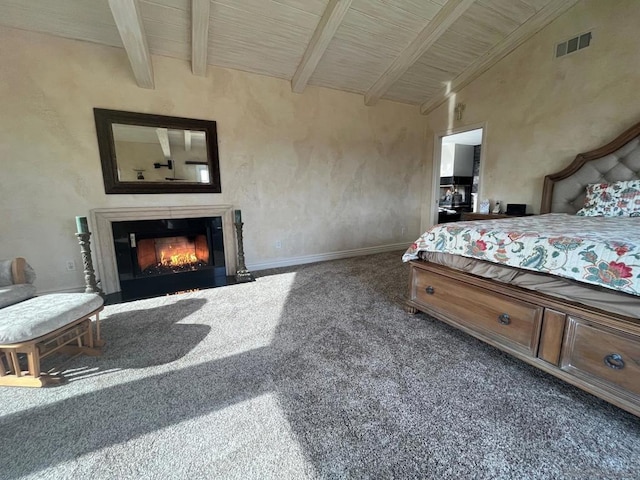 bedroom with vaulted ceiling with beams, wooden ceiling, and dark colored carpet