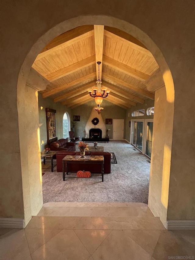 living room featuring wood ceiling and lofted ceiling with beams