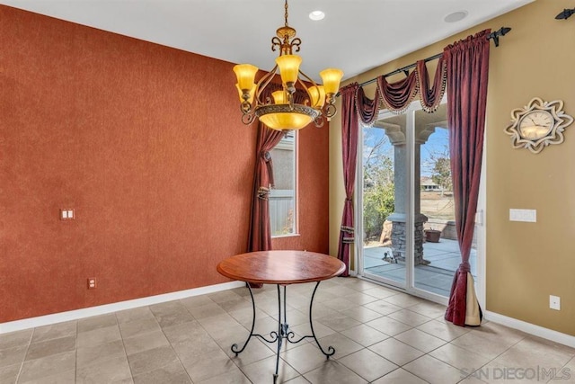 unfurnished dining area featuring a chandelier