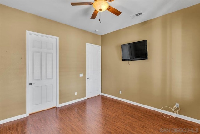 unfurnished bedroom featuring ceiling fan and hardwood / wood-style floors