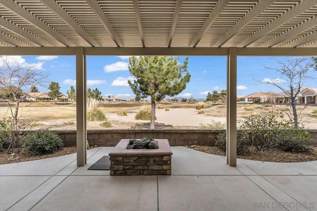 view of patio / terrace featuring a pergola and an outdoor fire pit