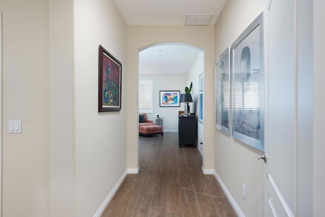 hallway featuring dark hardwood / wood-style flooring