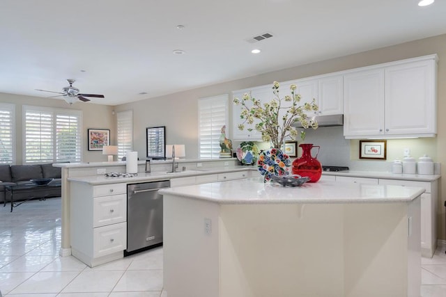 kitchen with dishwasher, a center island, sink, and kitchen peninsula