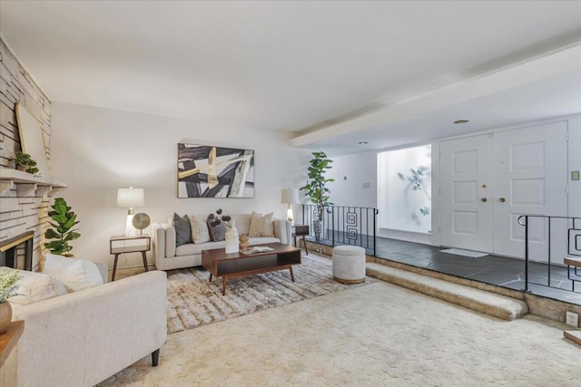 living room with carpet flooring and a fireplace