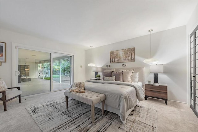 bedroom with light colored carpet and access to exterior