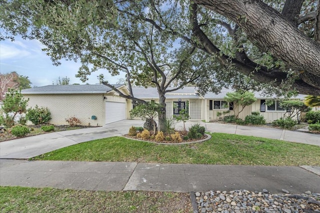 single story home with a garage and a front yard