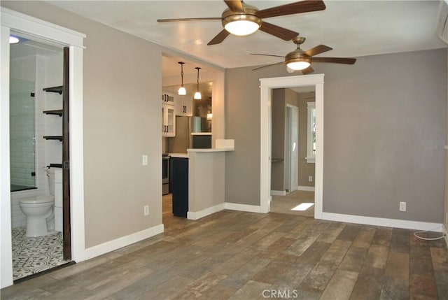 unfurnished living room with dark hardwood / wood-style flooring