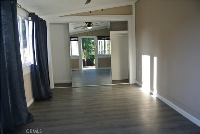 unfurnished room featuring lofted ceiling, dark hardwood / wood-style floors, and ceiling fan