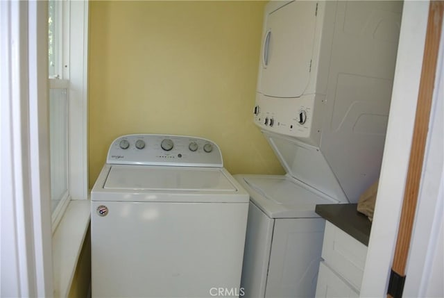 washroom featuring stacked washer and dryer