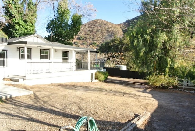 back of property featuring a mountain view