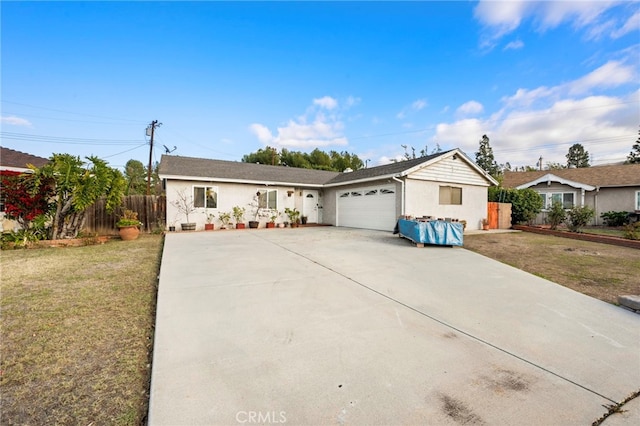 single story home with a garage and a front yard