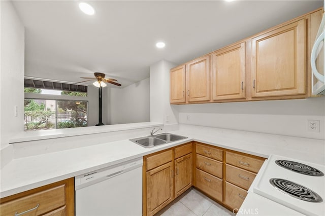 kitchen featuring light brown cabinetry, sink, white appliances, light tile patterned floors, and ceiling fan