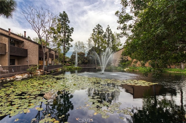 view of community with a water view