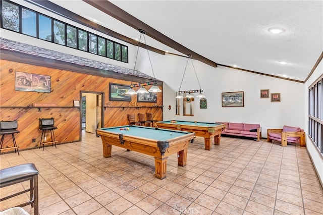 recreation room featuring light tile patterned floors, billiards, vaulted ceiling with beams, a textured ceiling, and wood walls