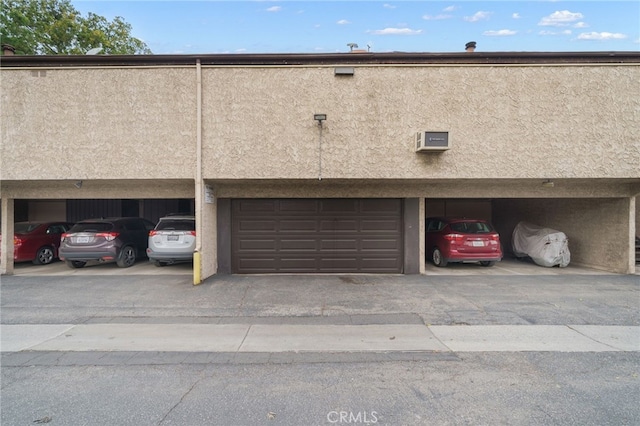 garage with an AC wall unit