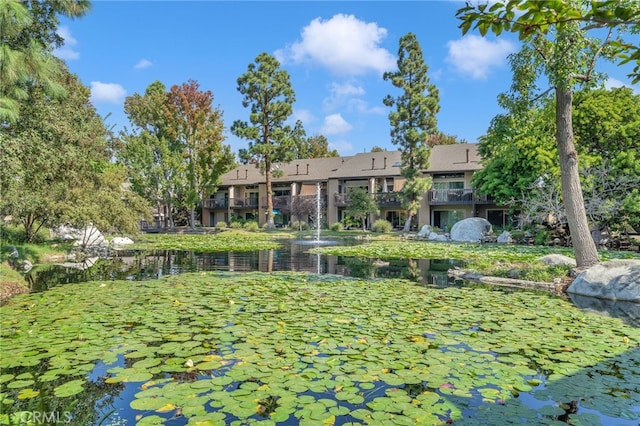 view of home's community with a water view