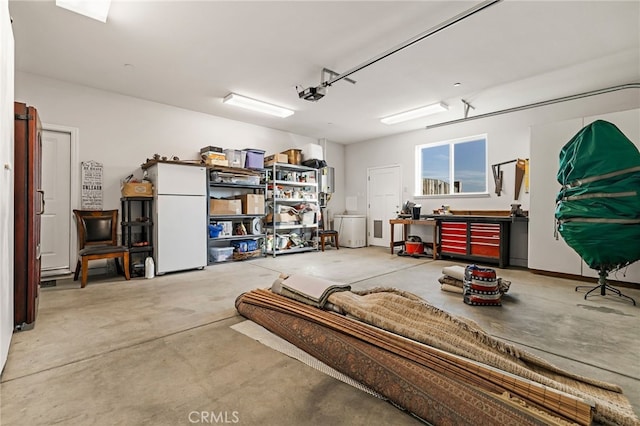 garage with a garage door opener and white fridge