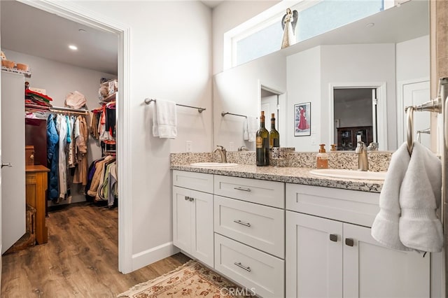 bathroom with vanity and hardwood / wood-style floors