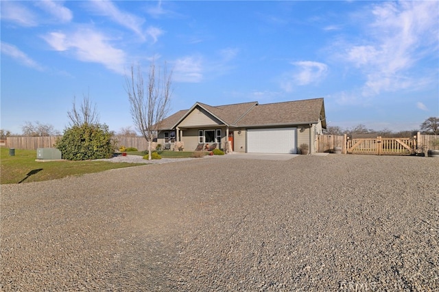 ranch-style home featuring a garage