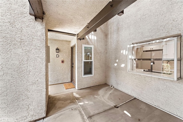 doorway to property featuring stucco siding