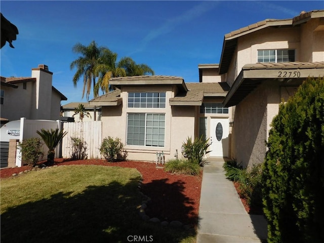 view of front of home with a front lawn