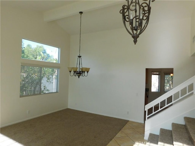 dining room with beam ceiling, high vaulted ceiling, a wealth of natural light, and an inviting chandelier