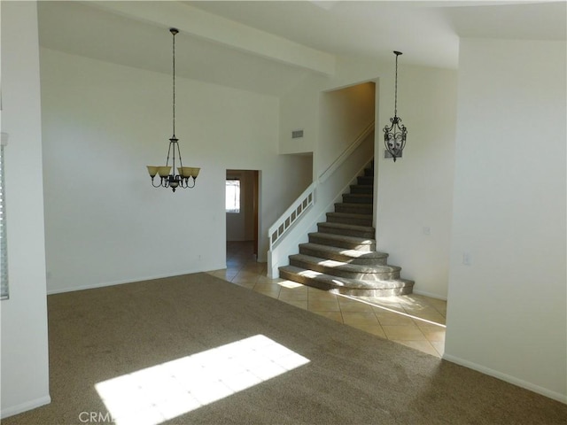 empty room featuring an inviting chandelier, light colored carpet, high vaulted ceiling, and beamed ceiling