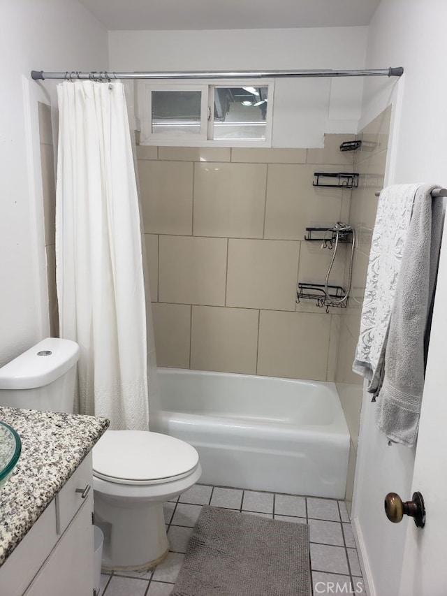 full bathroom featuring tile patterned flooring, vanity, shower / tub combo with curtain, and toilet