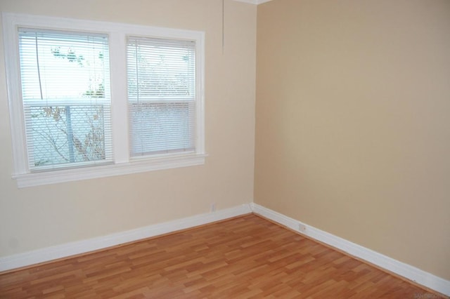 unfurnished room with a healthy amount of sunlight and light wood-type flooring