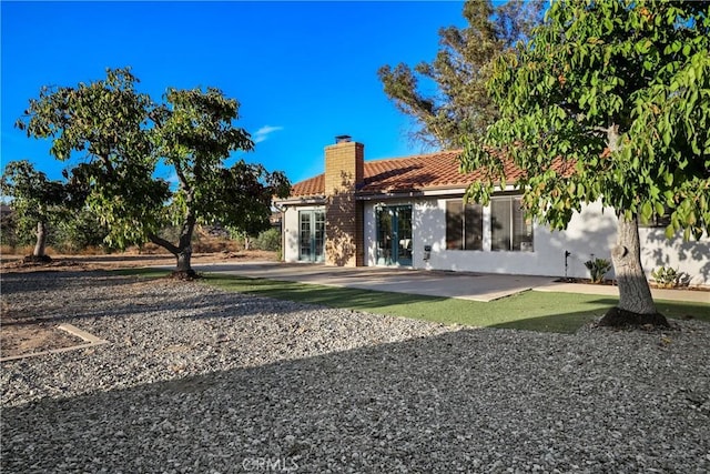 back of house featuring a patio